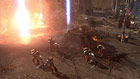 Des Space Marines abandonnent l'épave de leur Char Predator et s'aventurent à pied sur le champ de bataille.